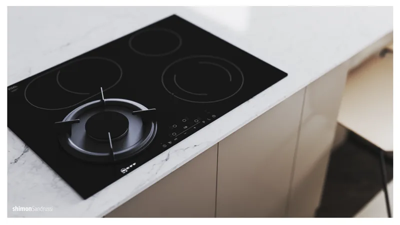 Close view of the kitchen cooktop and work surface